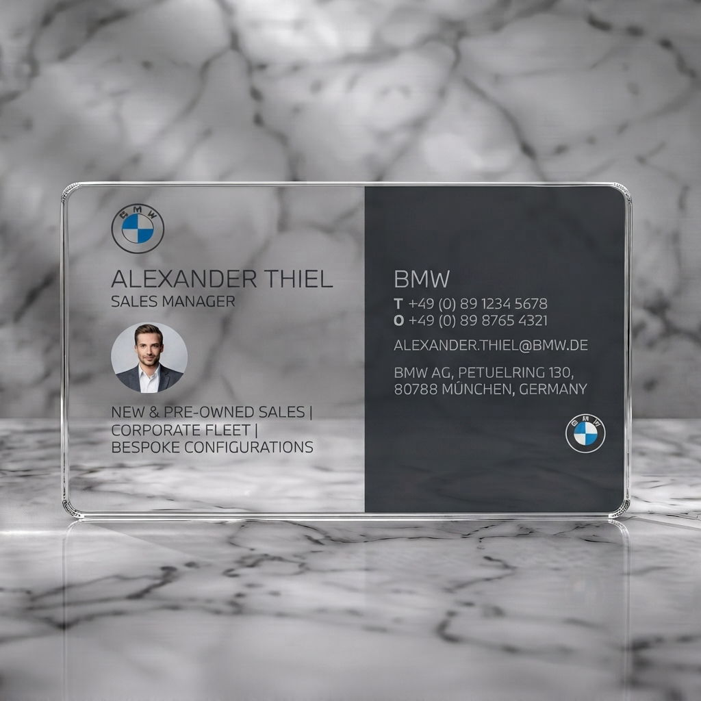 Clear plastic business card featuring modern two-panel design, BMW logos, crisp sans-serif type, and a circular profile photo