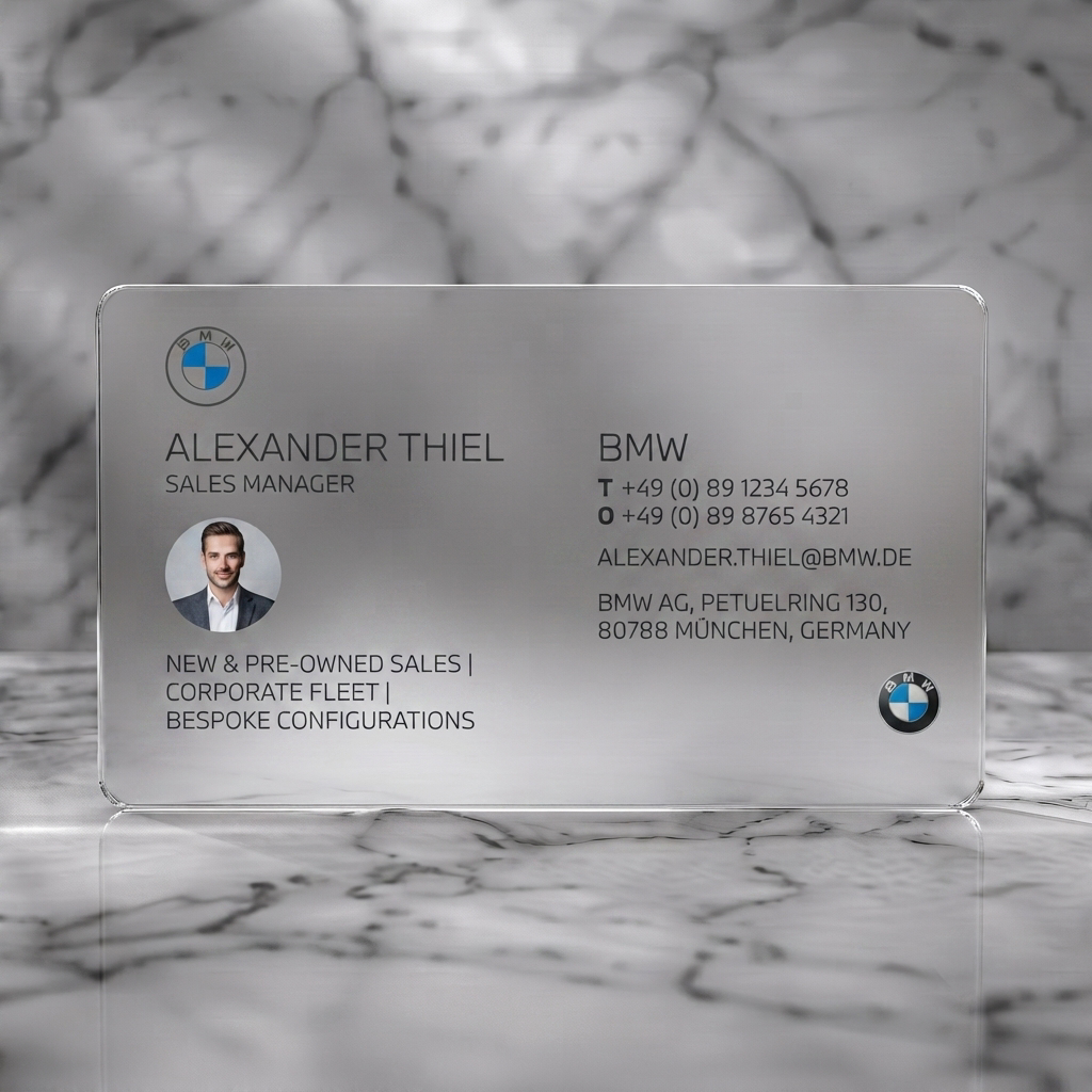 Frosted translucent plastic business card featuring modern two-panel design, BMW logos, crisp sans-serif type, and a circular profile photo