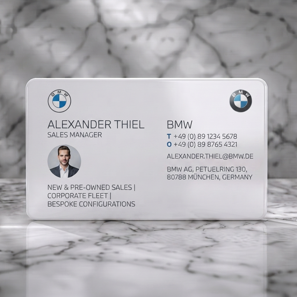 Solid white PVC business card featuring modern two-panel design, BMW logos, crisp sans-serif type, and a circular profile photo