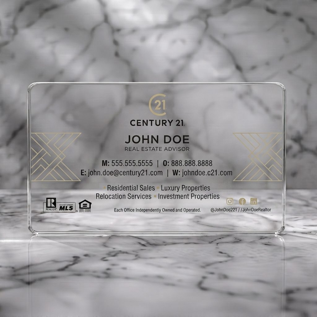 Clear plastic business card featuring modern, minimalist design with gold geometric accents, black text, and essential real estate branding
