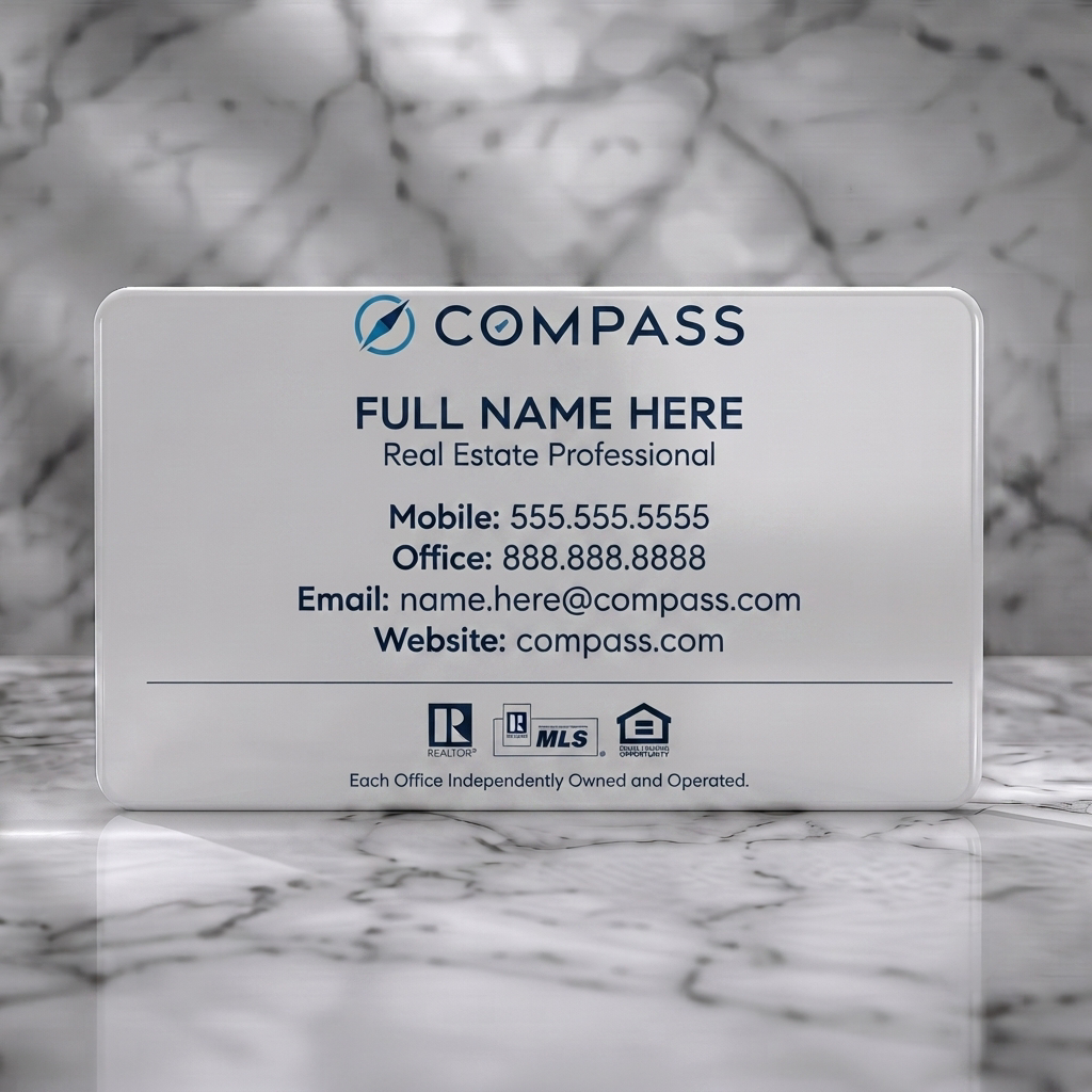 Solid white PVC business card featuring minimalist white and dark blue design, sans-serif typography, Compass logo, and real estate icons
