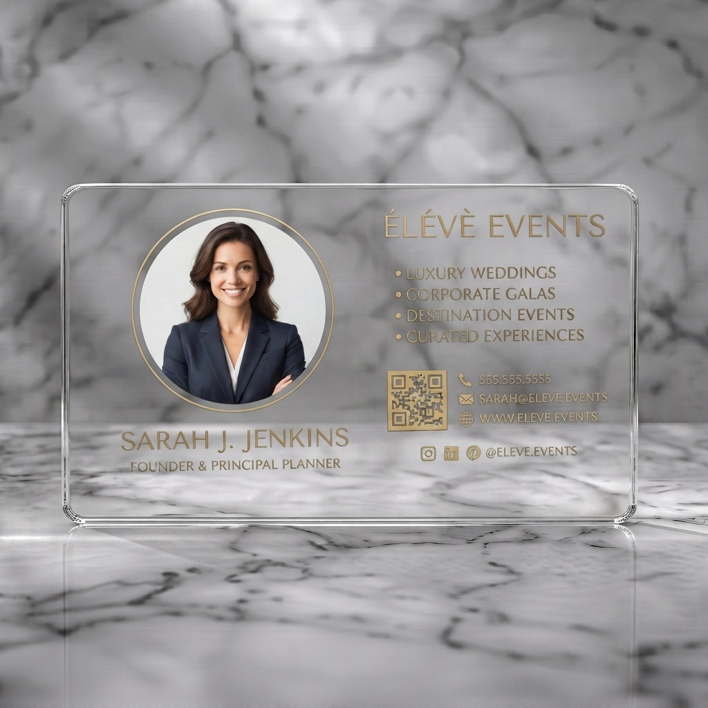 Clear plastic business card featuring sophisticated dark card with gold accents, sans-serif fonts, contact icons, and a prominent headshot