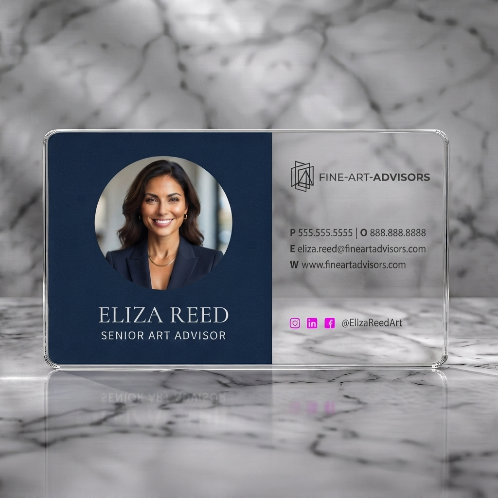 Clear plastic business card featuring a refined, two-toned design in navy and cream, featuring a profile photo, elegant type, and geometric logo