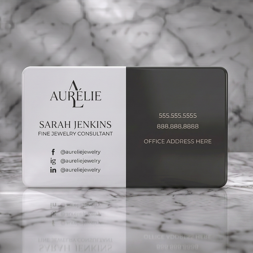 Solid white PVC business card featuring elegant, modern split design featuring charcoal, diverse typography, and social icons