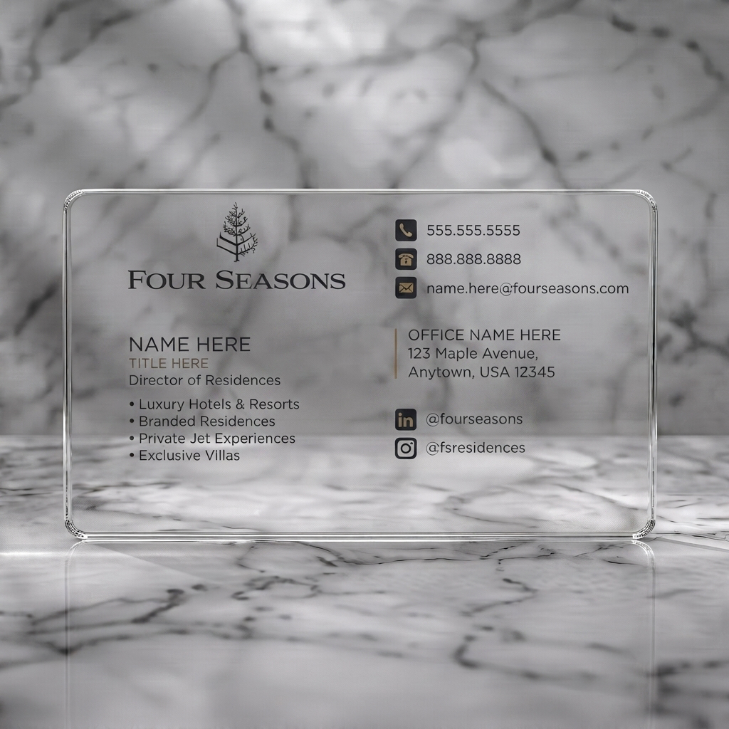 Clear plastic business card featuring clean, minimalist design, charcoal and off-white palette, elegant serif/sans-serif typography, and key contact icons