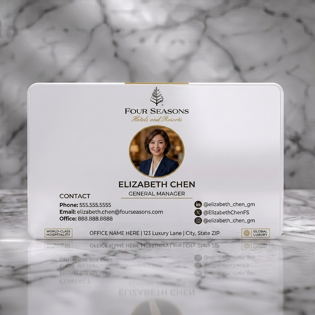 Solid white PVC business card featuring elegant white and gold design with serif and sans-serif fonts, professional photo, and social media icons