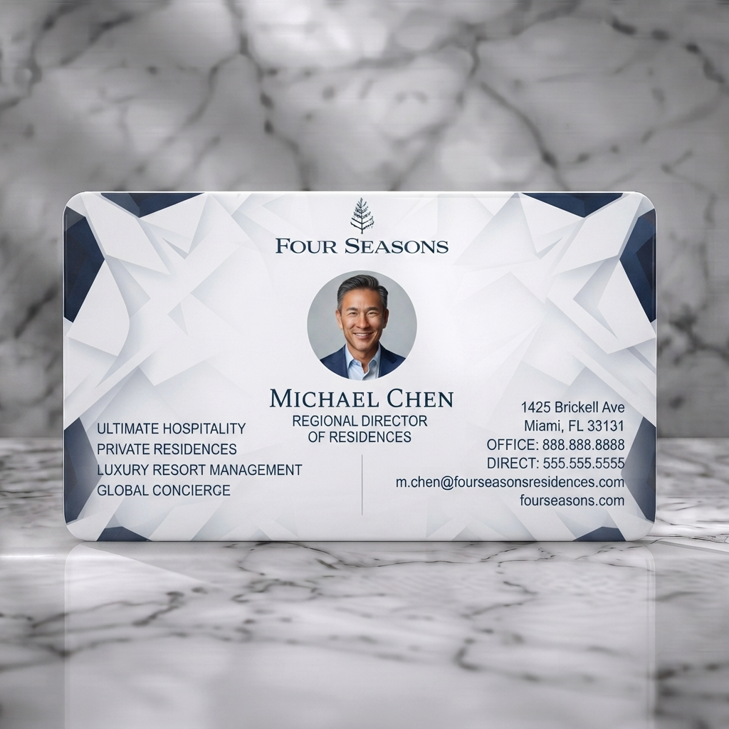 Solid white PVC business card featuring modern geometric navy/white pattern, elegant fonts, luxury brand logo, professional headshot