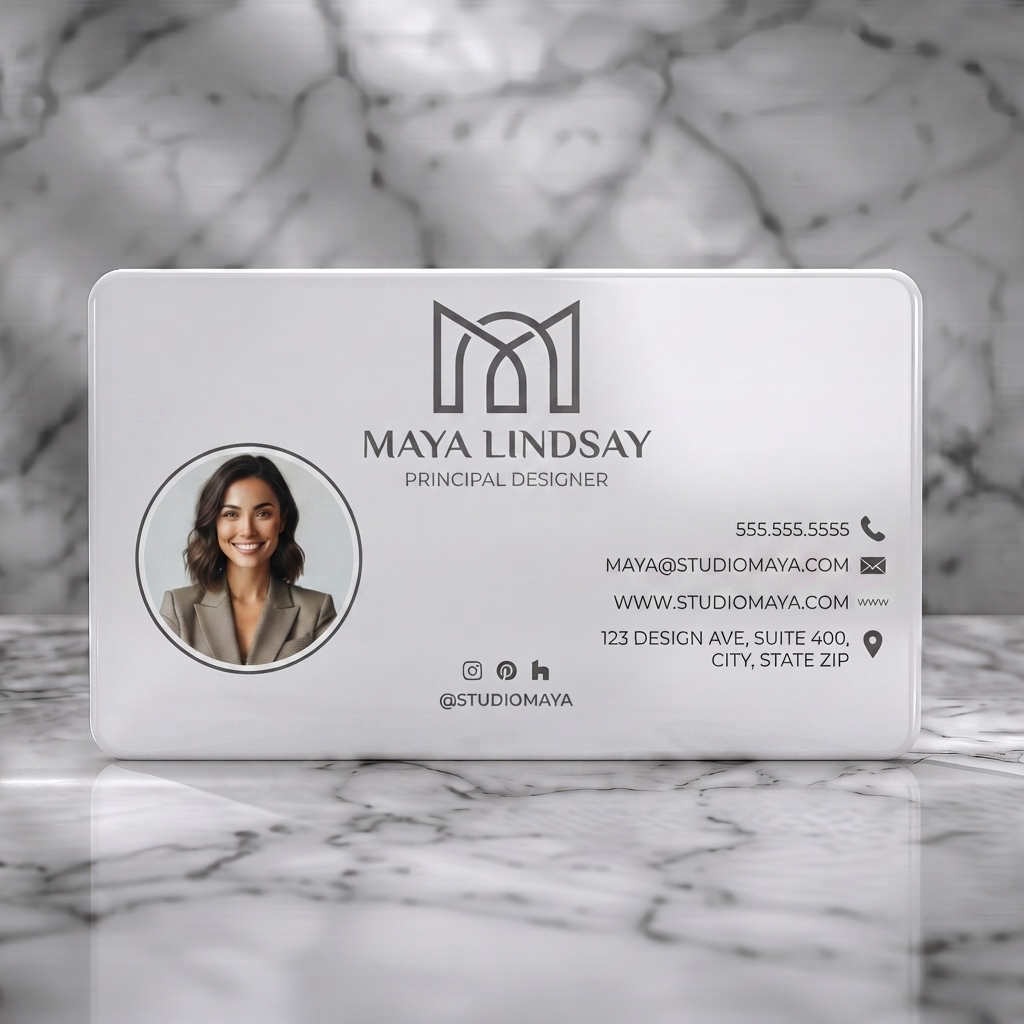 Solid white PVC business card featuring modern, minimalist design in monochrome, a geometric 'M' logo, sans-serif fonts, and relevant contact icons