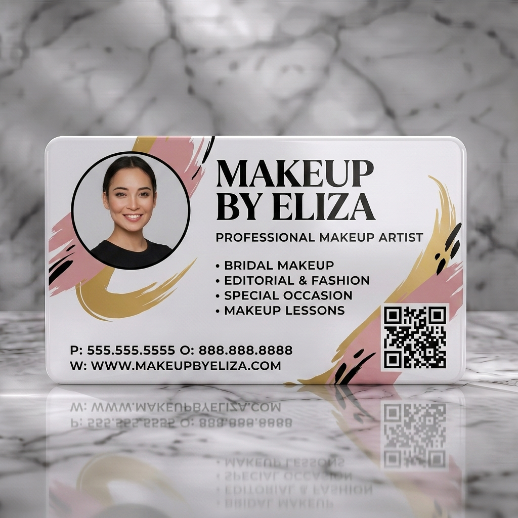Solid white PVC business card featuring a stylish photo, elegant black serif typography, artistic gold and blush brushstrokes, and a QR code