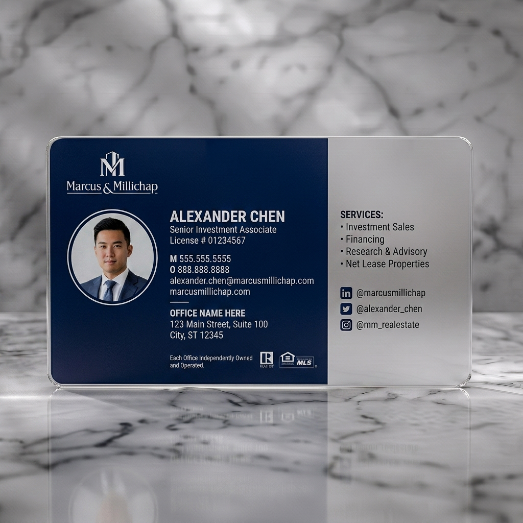 Frosted translucent plastic business card featuring sleek navy blue design, white typography, M&M logo, photo, Realtor, MLS, and social media icons