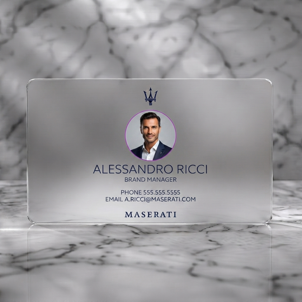 Frosted translucent plastic business card featuring a modern navy blue design with crisp white typography, Maserati trident, and a circular headshot