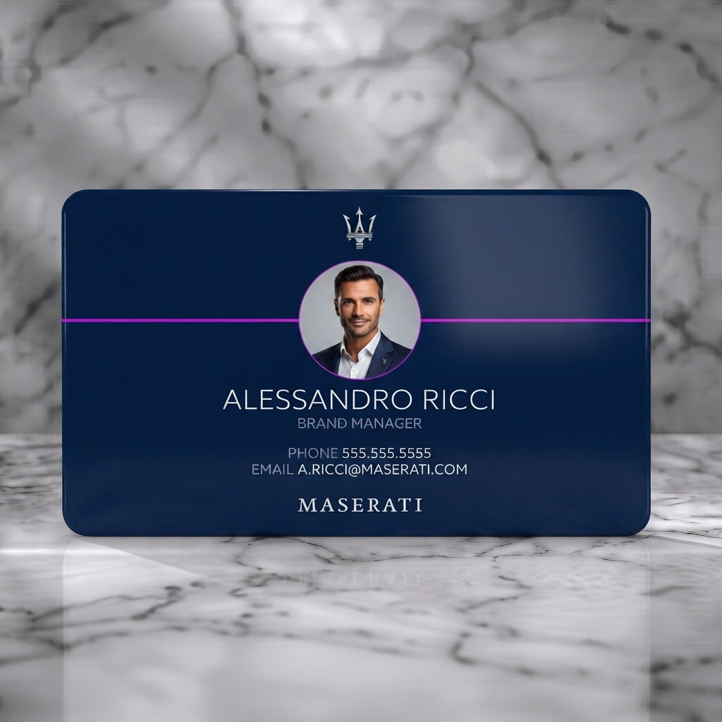 Solid white PVC business card featuring a modern navy blue design with crisp white typography, Maserati trident, and a circular headshot