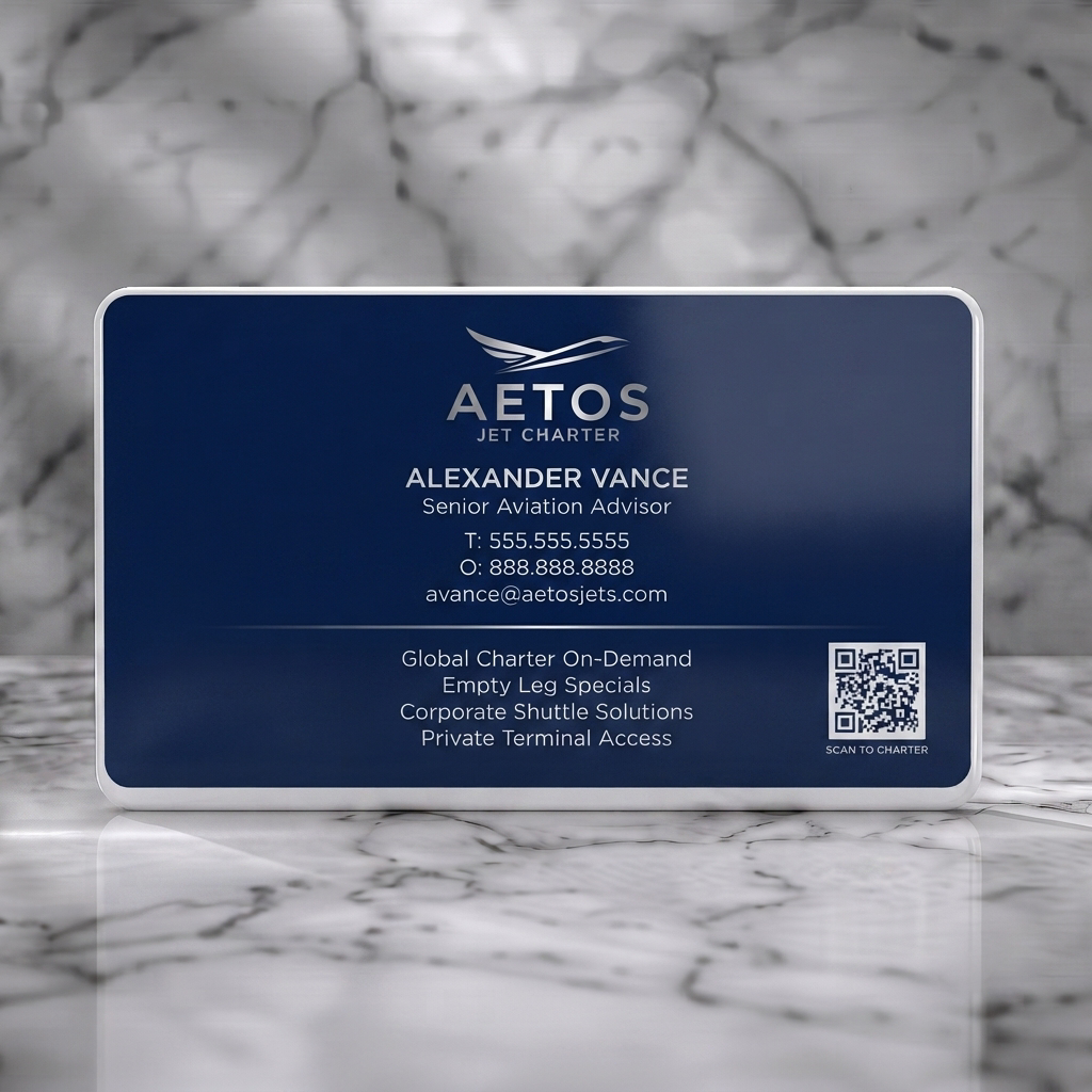 Solid white PVC business card featuring a sleek navy blue and silver design, modern sans-serif typography, abstract jet logo, and QR code
