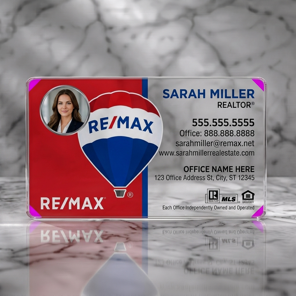Clear plastic business card featuring split red/white design, RE/MAX logo, realtor photo, bold sans-serif typography, industry icons