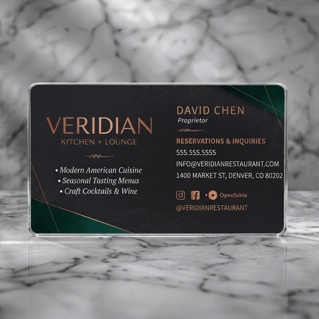 Clear plastic business card featuring luxurious dark geometric design with copper text, emerald accents, and social media icons