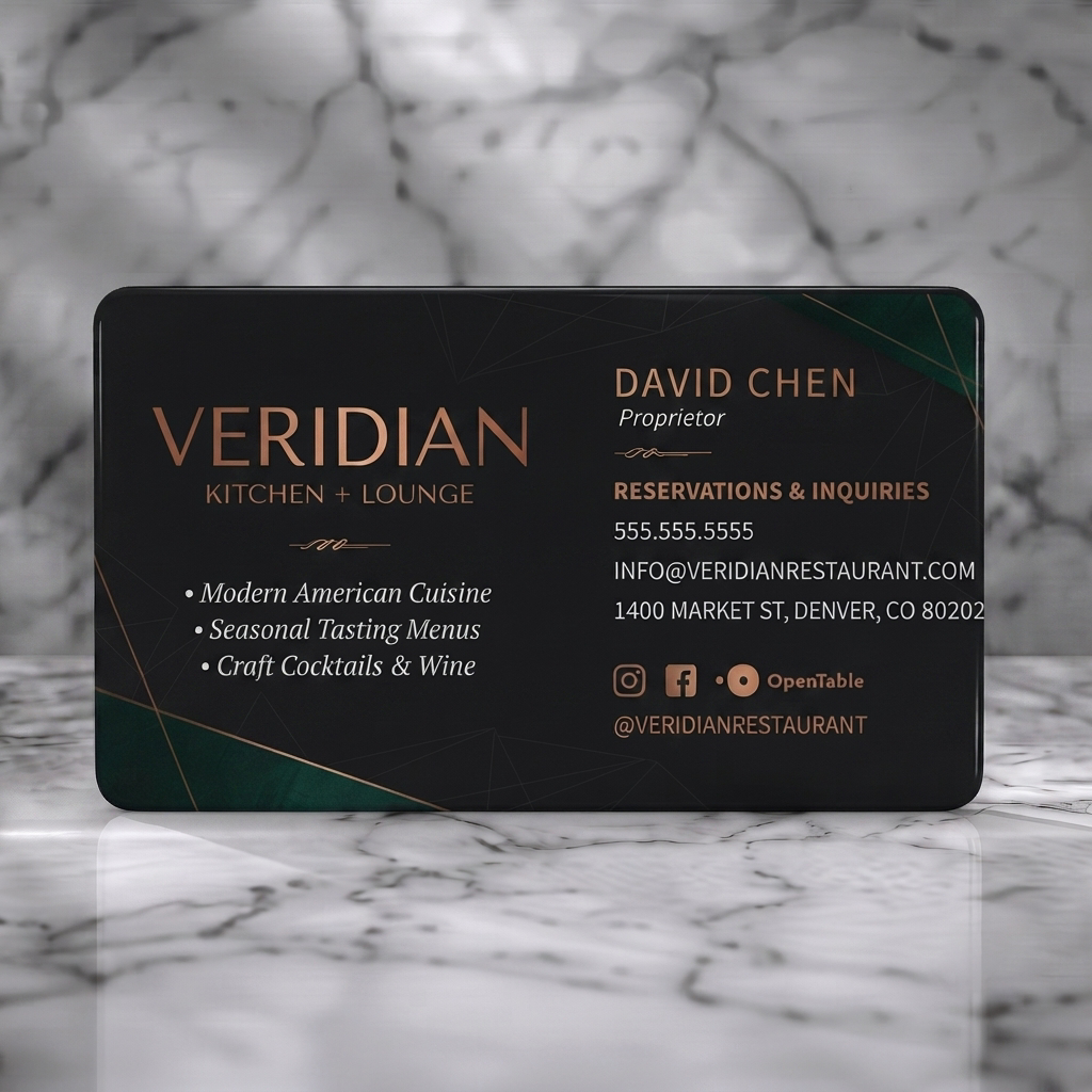 Solid white PVC business card featuring luxurious dark geometric design with copper text, emerald accents, and social media icons