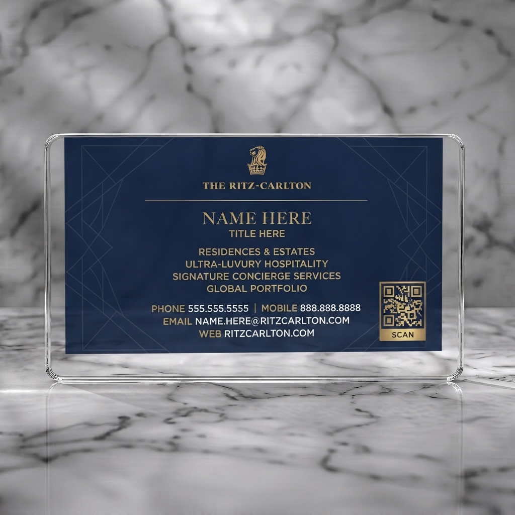 Clear plastic business card featuring an elegant navy and gold design, classic serif typography, brand logo, subtle pattern, and QR code