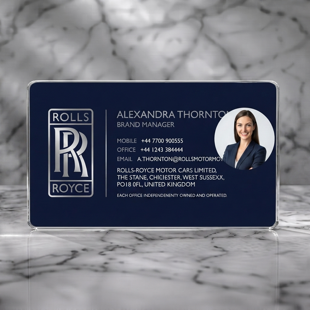 Clear plastic business card featuring elegant, minimalist design; navy and silver branding; clean sans-serif typography; Rolls-Royce logo and photo