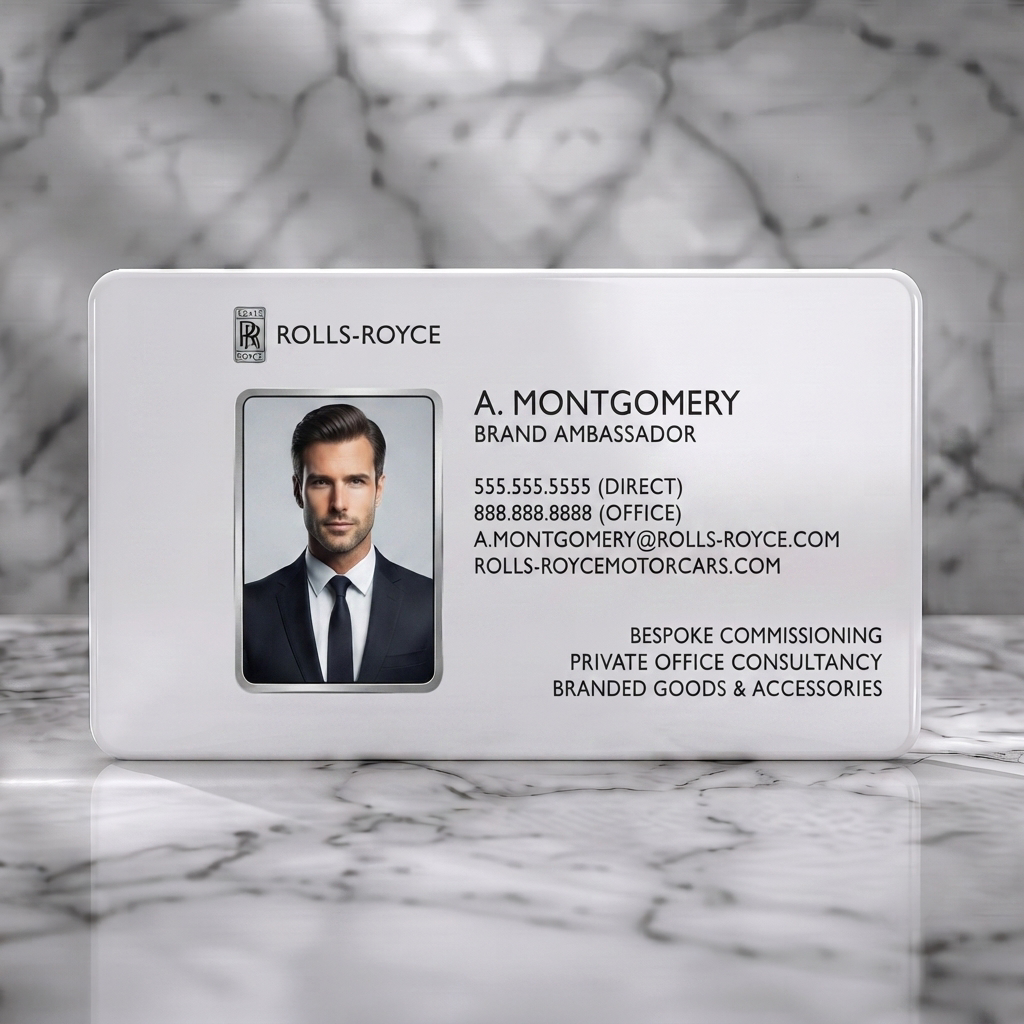 Solid white PVC business card featuring a sleek black design with silver accents, professional photo, clean sans-serif typography, and RR logo