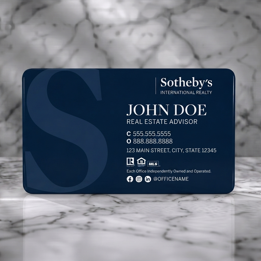 Solid white PVC business card featuring a sophisticated navy design, elegant serif and clean sans-serif typography, and subtle realty/social icons