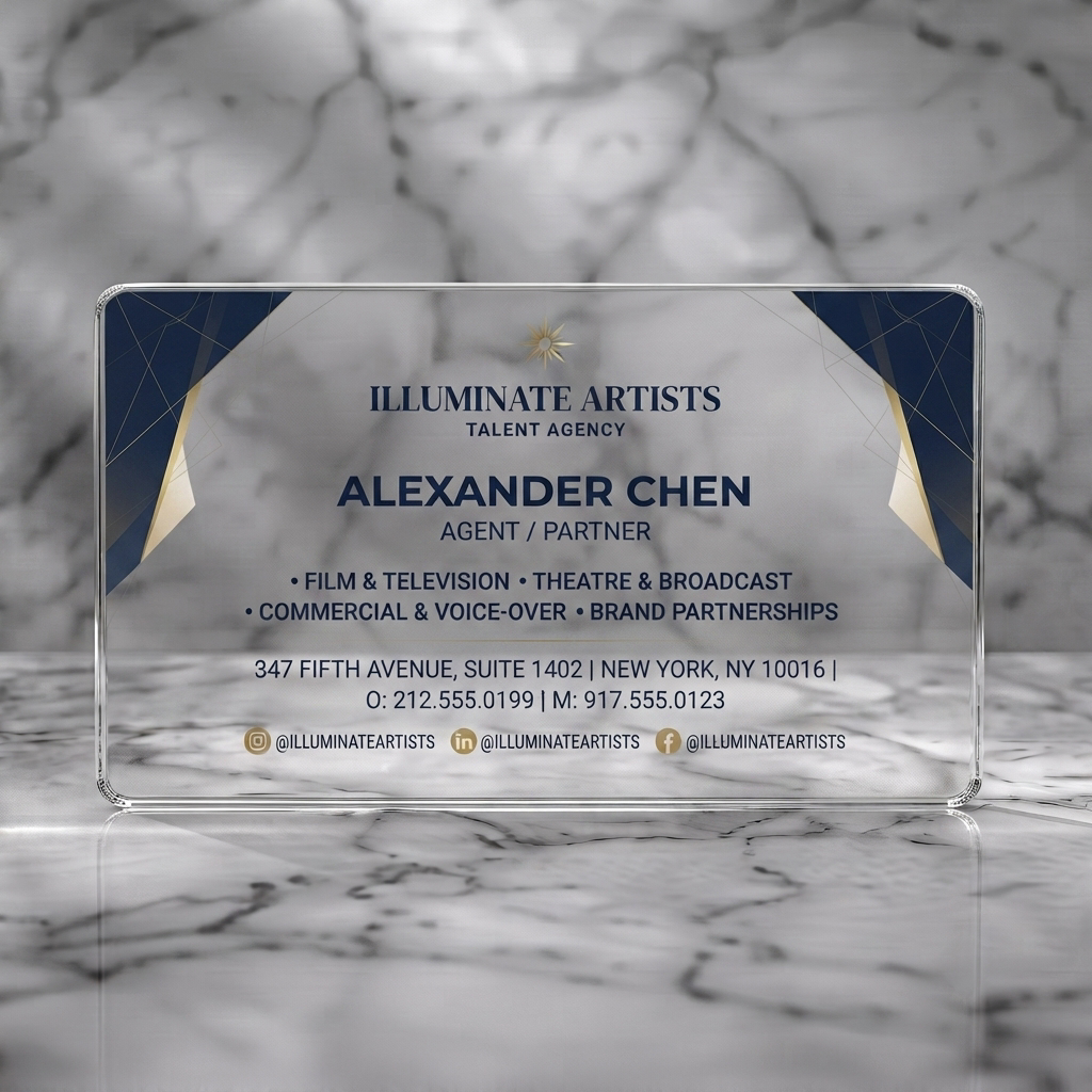 Clear plastic business card featuring modern geometric design with navy and gold accents, clean sans-serif typography, a sunburst logo, social media icons