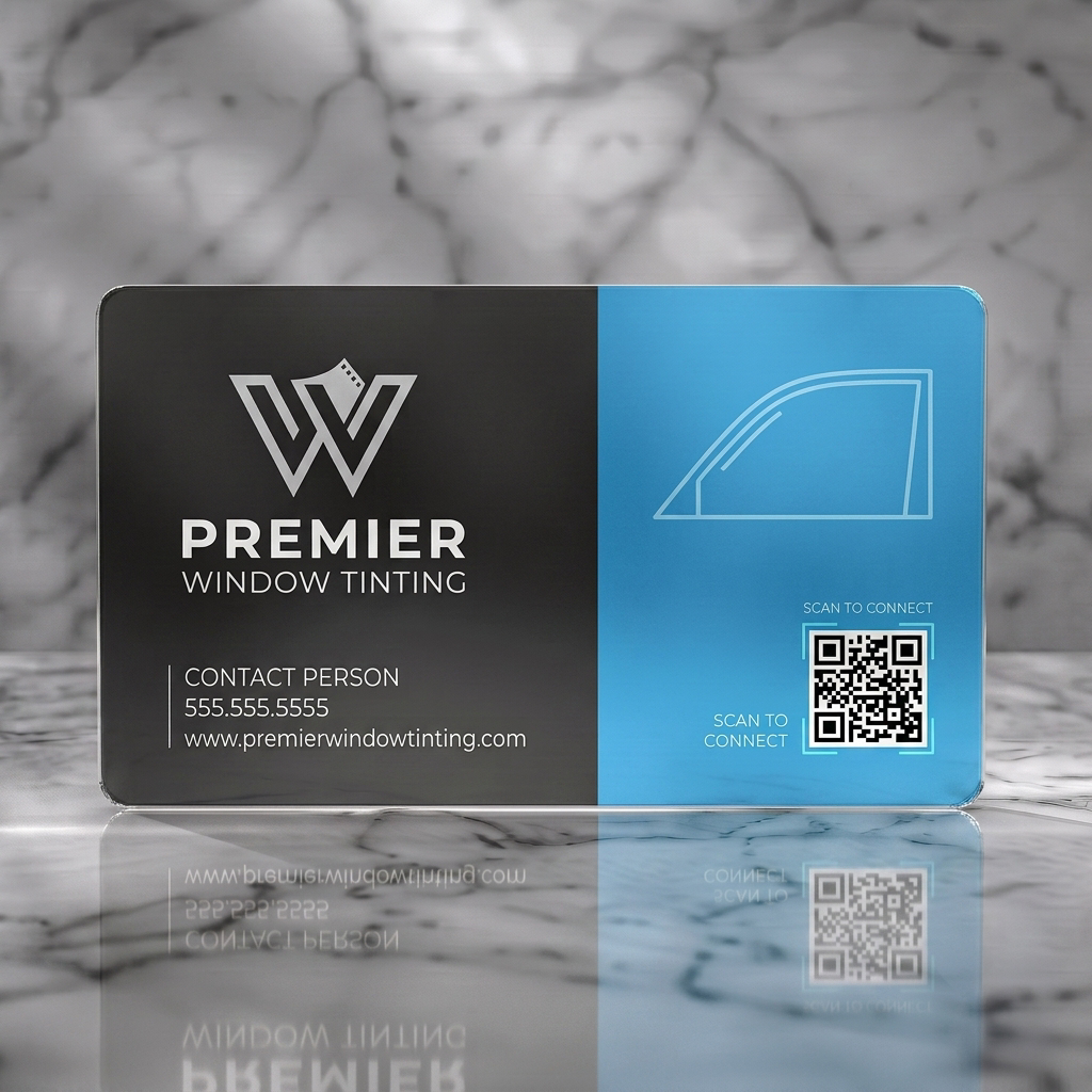 Frosted translucent plastic business card featuring modern two-tone blue and grey design, 'W' film-strip logo, car window graphic, QR code
