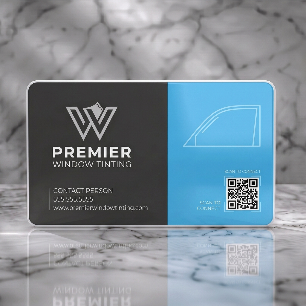 Solid white PVC business card featuring modern two-tone blue and grey design, 'W' film-strip logo, car window graphic, QR code